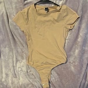 Nude tshirt bodysuit. Available for discount bundle with other qualifying items!